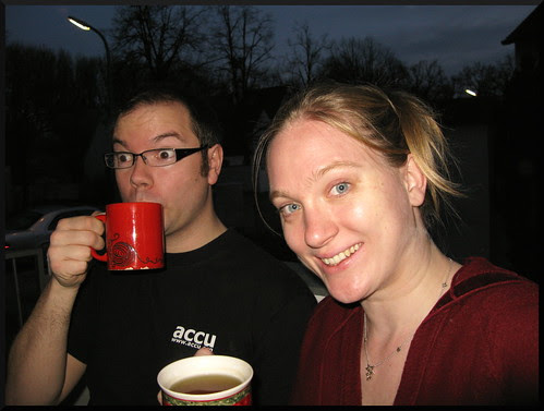 Day 234. Geoff and Nicole drinking hot beverages on our new flats balcony